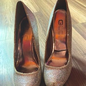 A very used pair of GLO jeans stiletto shoes size 8 in women’s about 3 inch heel